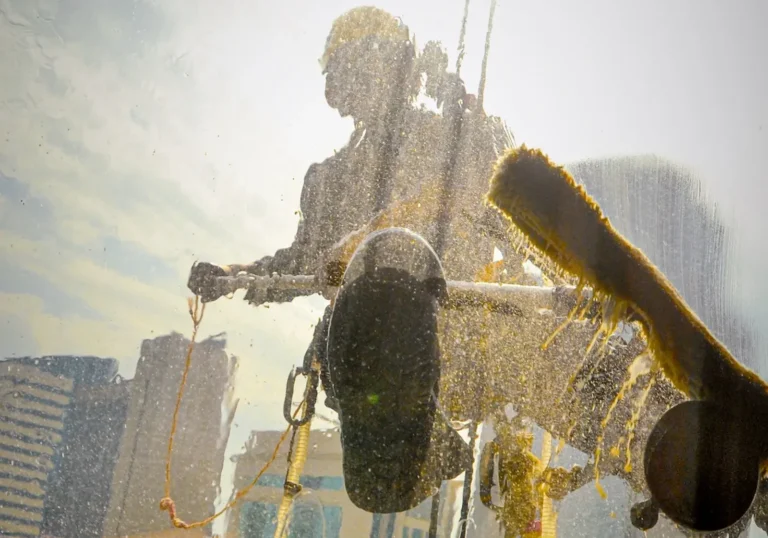 rope access technician performing exterior cleaning